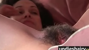 Impressive woman plays with innate pussy covered in fur